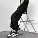 Wiaofellas  -  Men Outdoor Multiple Pockets Cargo Pants Spring Casual Drawstring Baggy Wide-leg Trousers Hip Hop Fashion Pantalones