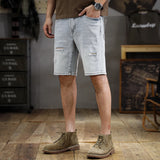 Wiaofellas  -  The new summer fashion men's washed and ground white ripped denim shorts men's slim straight casual five-point medium pants